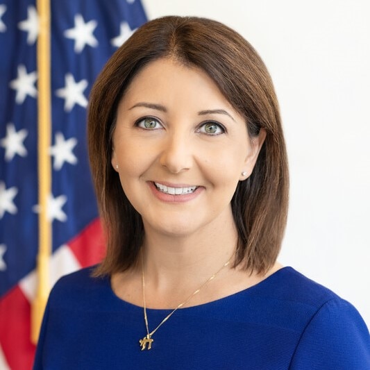 Headshot of CDC Director/ATSDR Administrator Mandy Cohen is in front of the American flag.