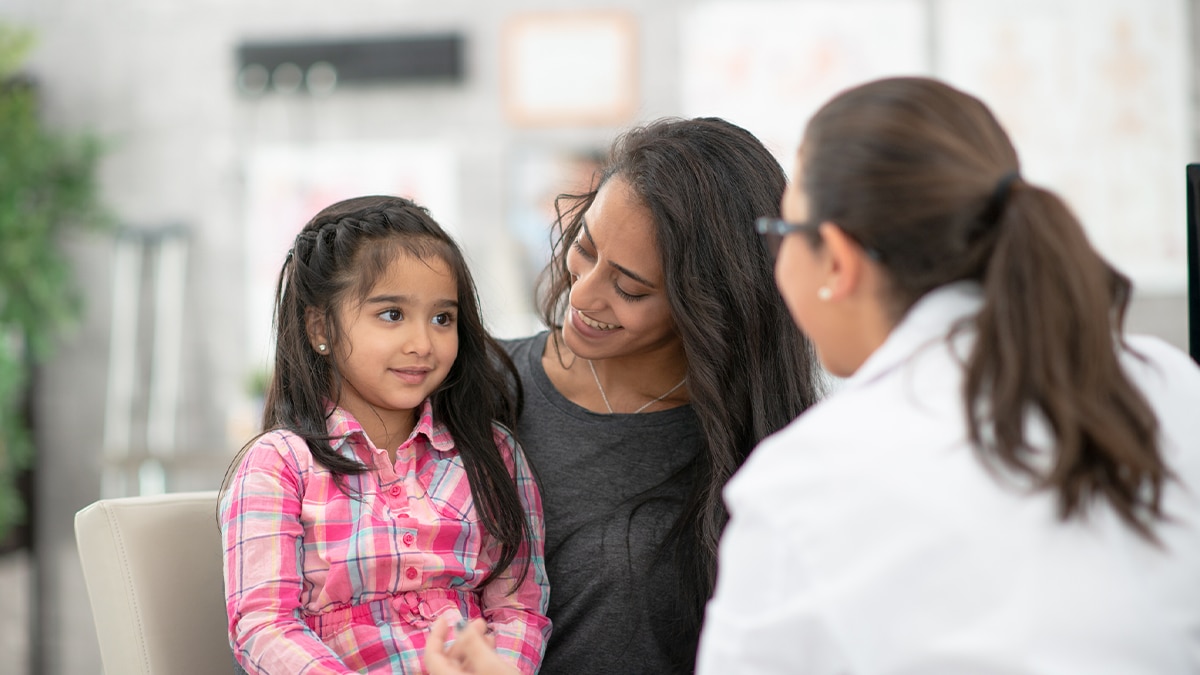 A mother and daughter visiting the doctor's office