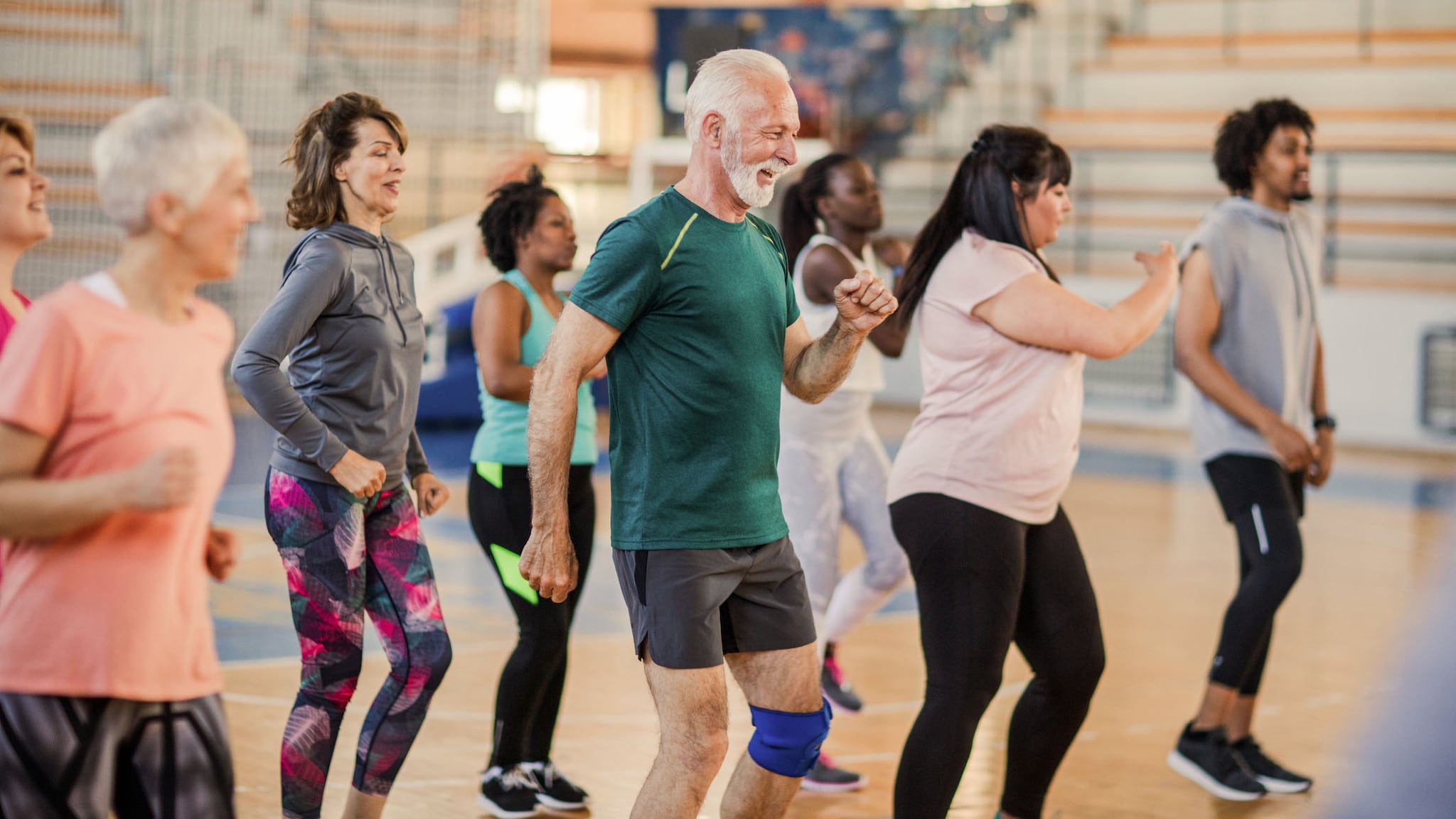 group of adults participating in a dance class