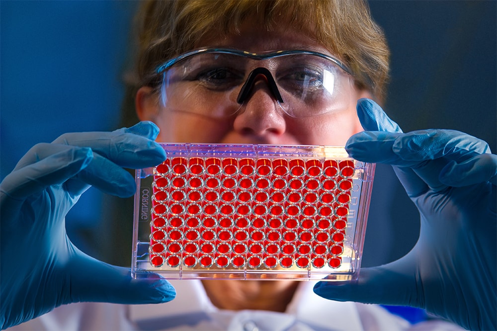 Lab tech handling samples