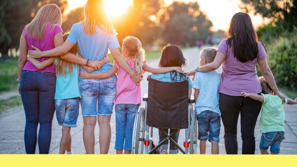 group of children and caregivers watching sunset