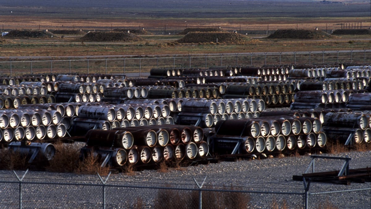 An image of bulk chemical containers stored outside.