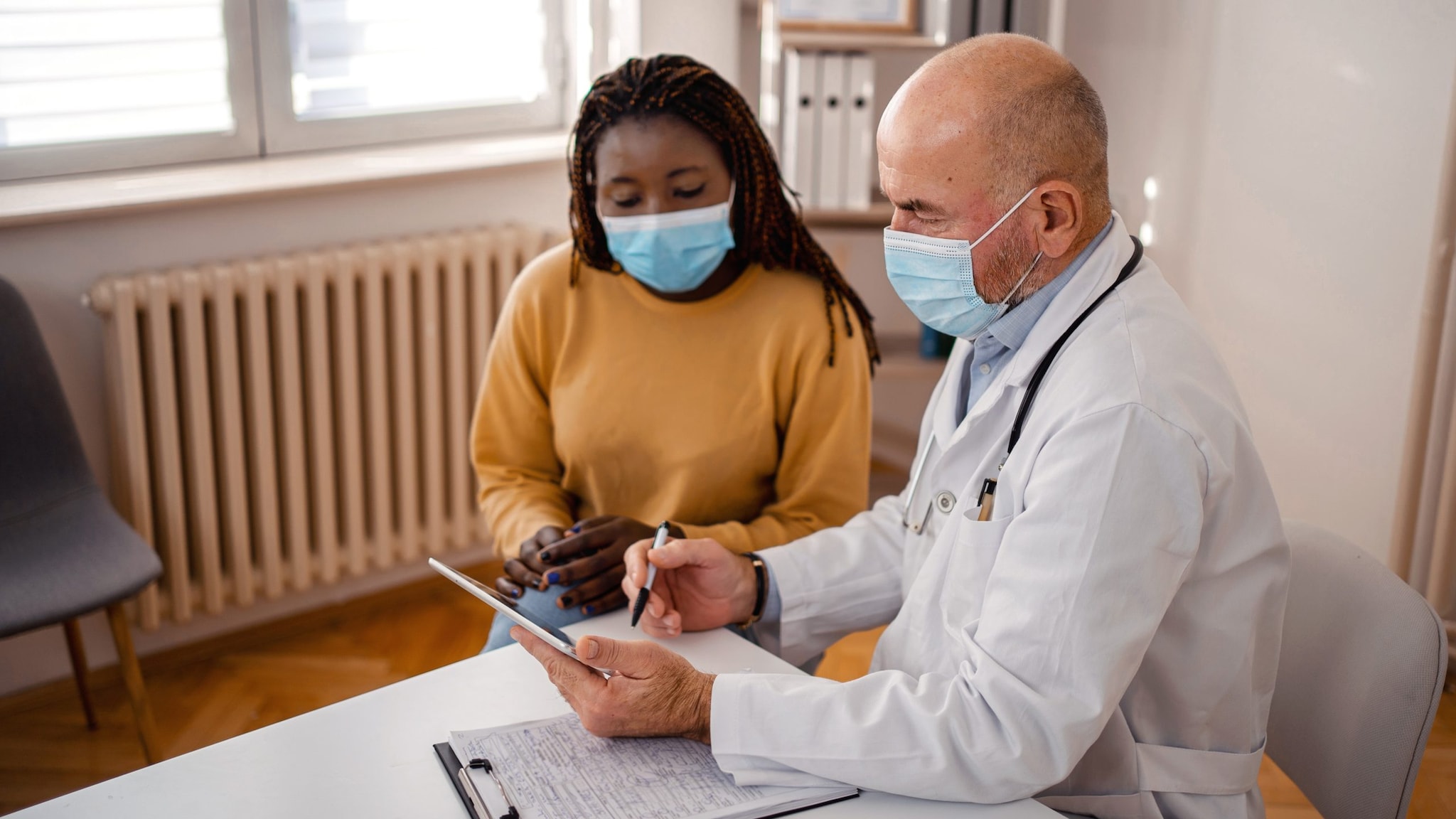 Doctor talking to patient