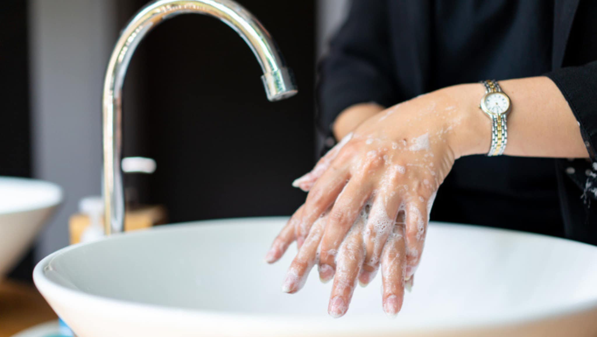 person washing their hands