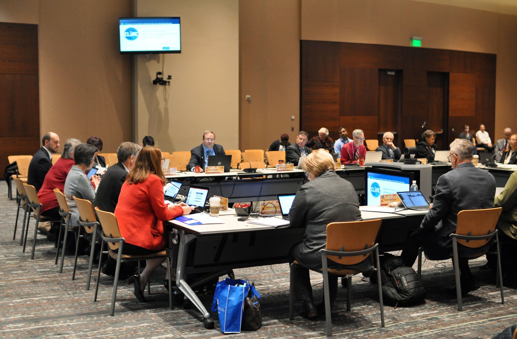 Committee working at a conference table.