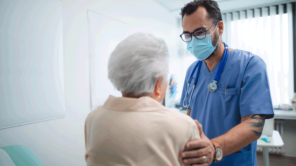 Doctor assuring older female patient