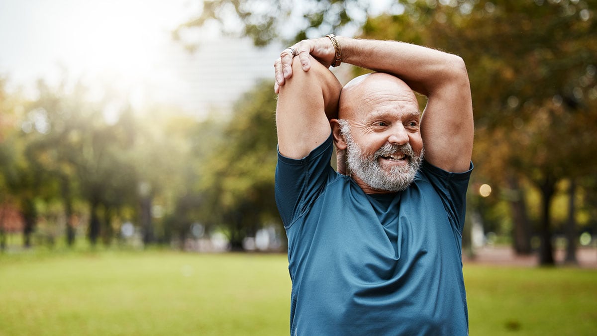 elderly man stretching before exercise