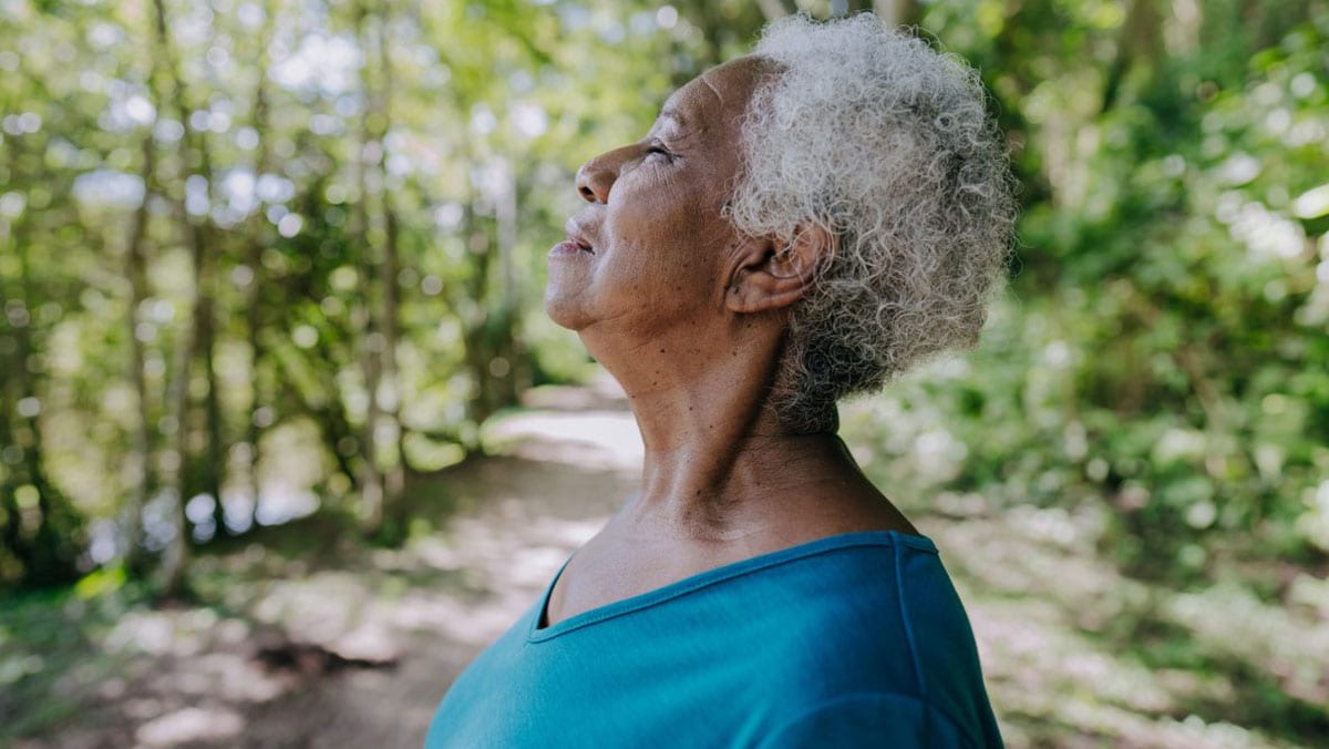 woman looking content outdoors