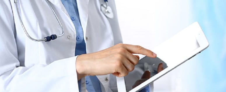 Doctor holding a tablet device.