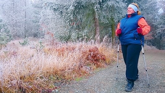 Woman walking outside in winter.