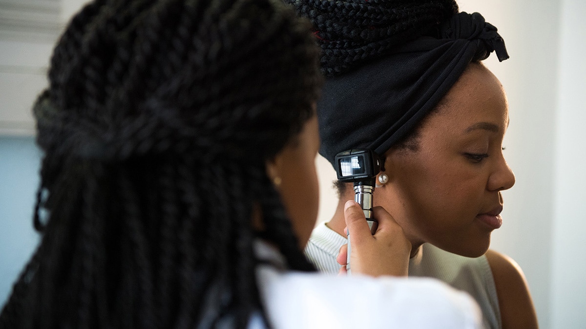 woman gets ear exam