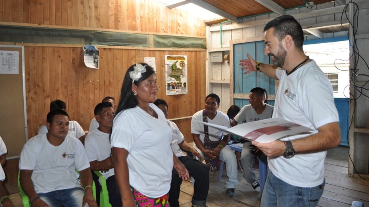 man speaking to a group of people