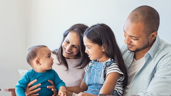 Family playing with baby