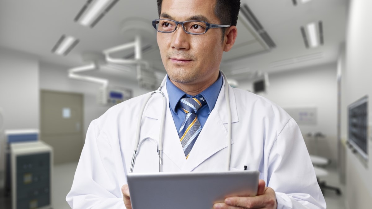 a doctor holding a digital tablet