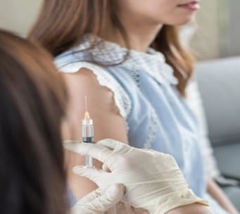 Woman receives vaccination