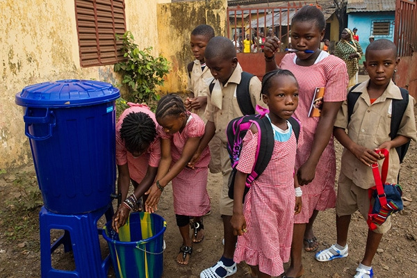 Photo of people washing hands