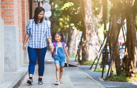 Mother and daughter walking