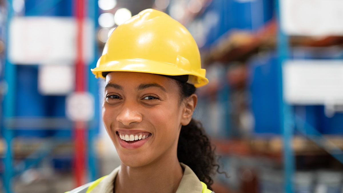 An employee in a hard hat.