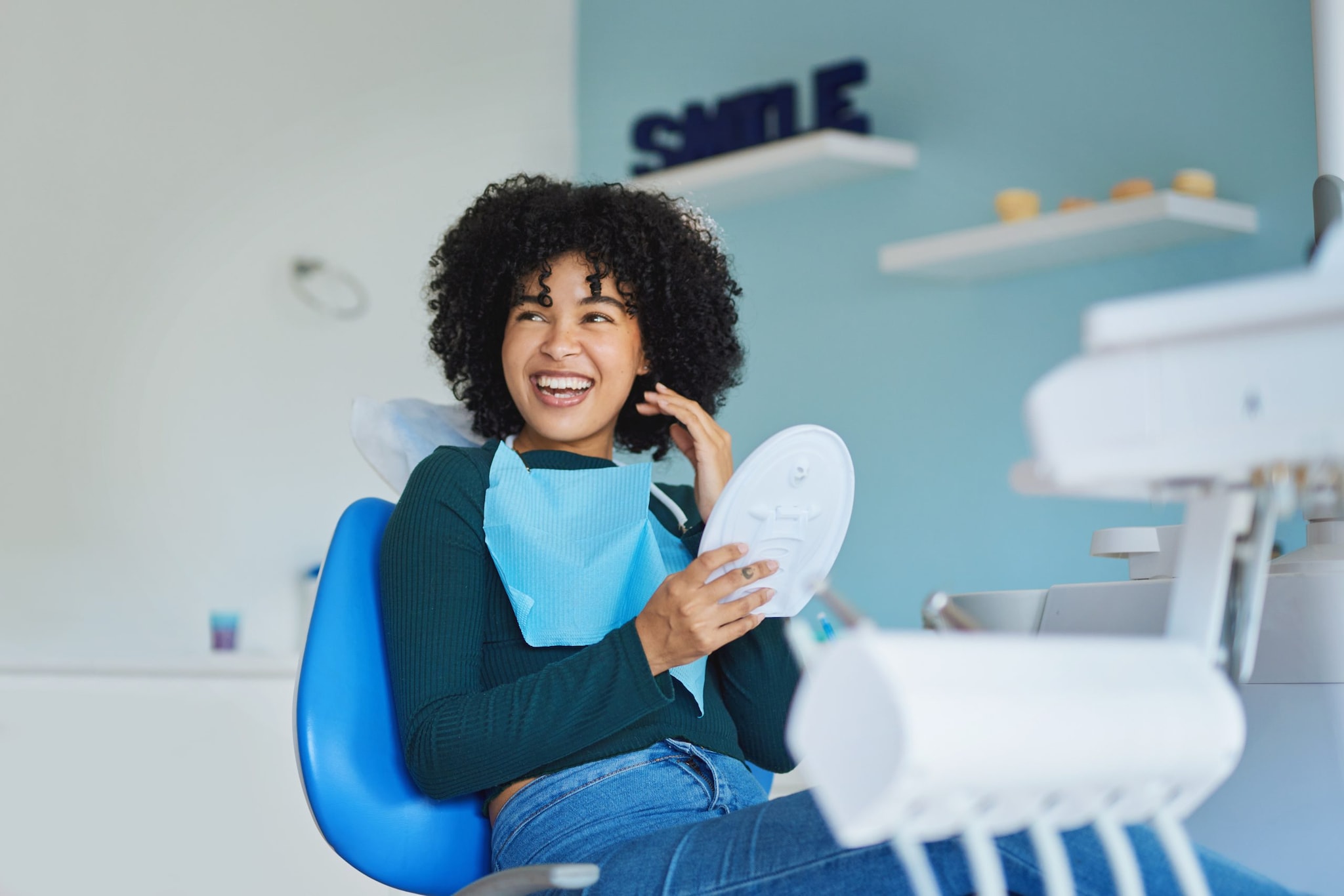 Happy woman in dental chair