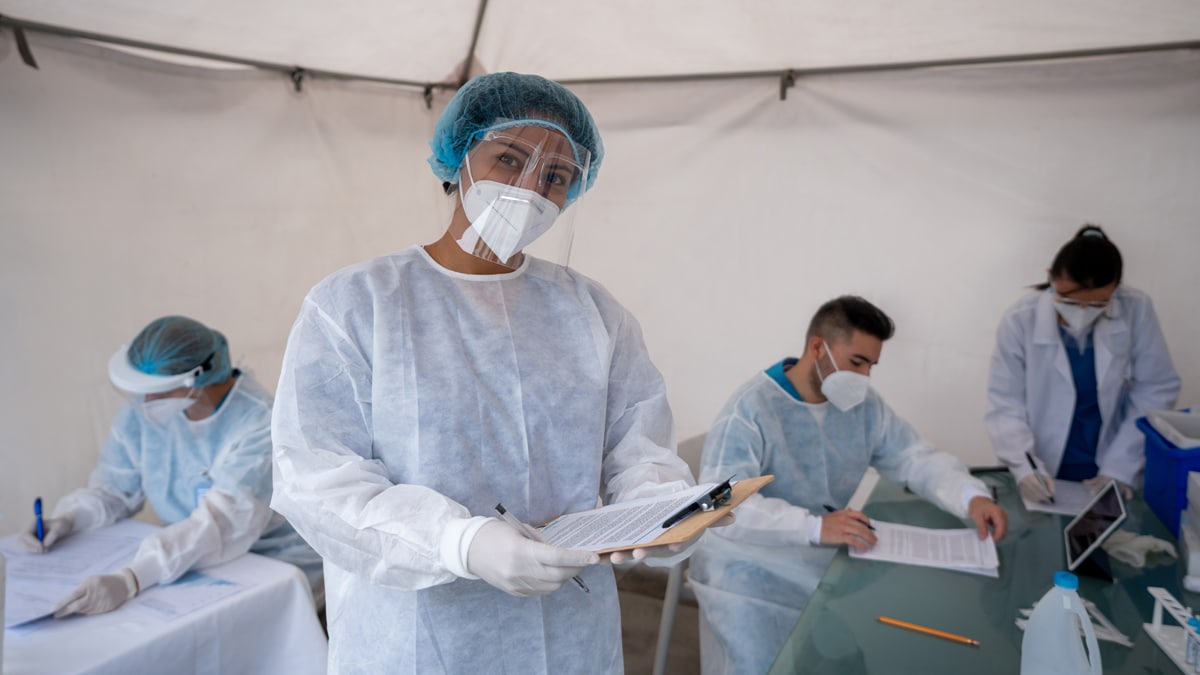 Healthcare worker working at a COVID-19 vaccination stand