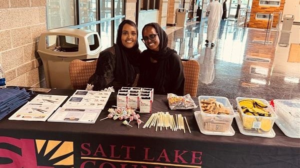 Ayan (left) and Halima (right) tabling at a graduation event for Somali residents completing their Koran study courses.