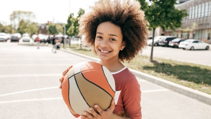 boy holding basketball