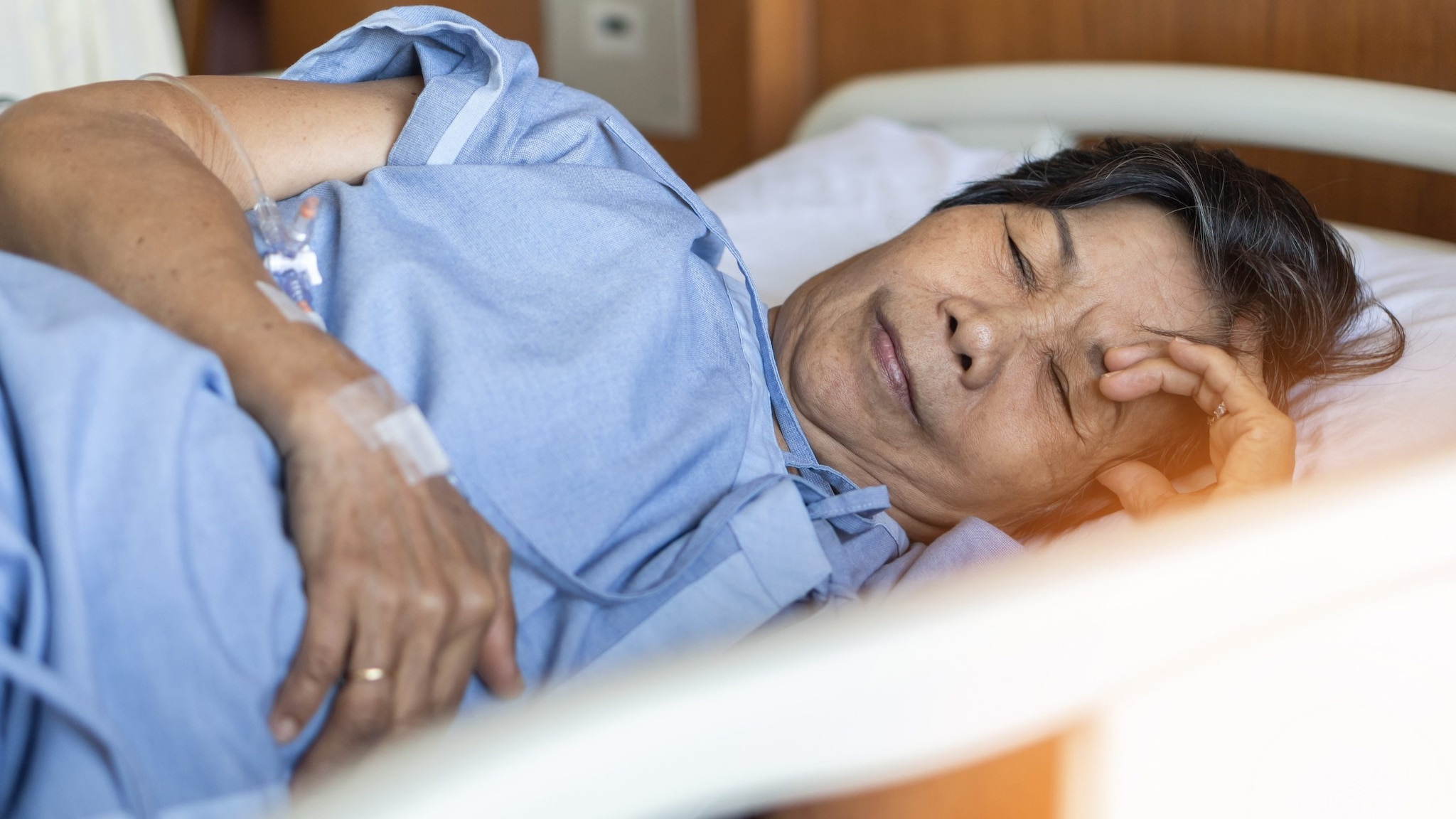 Woman sick in a hospital bed