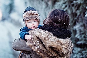 Alaska Native women holding her baby