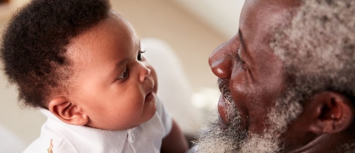 Grandfather holding baby