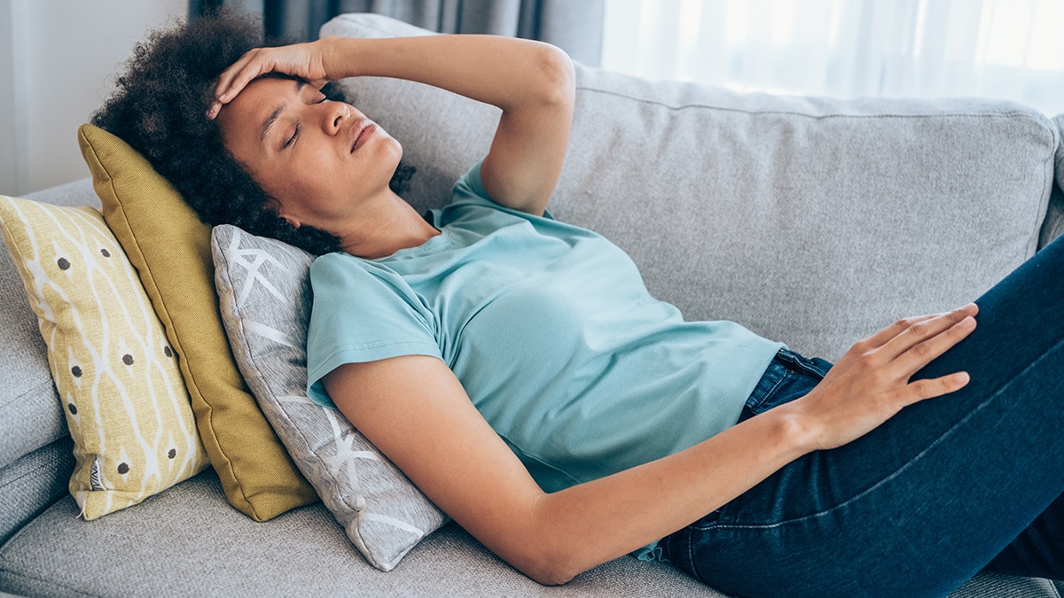 Woman lying on a couch.