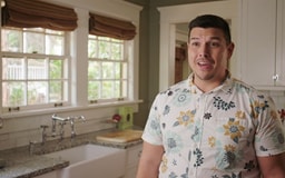 Hawaiian male standing in kitchen talking to camera