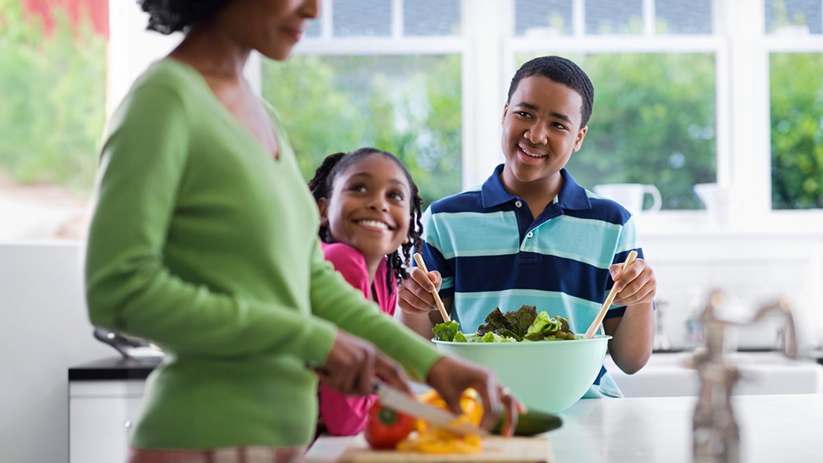 A family in the kitchen.