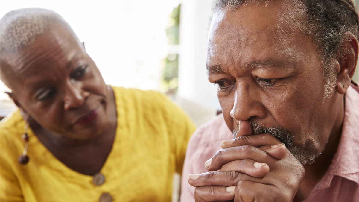 Couple looking concerned.