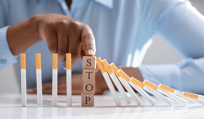 hand pointing to stop smoking cigarettes