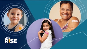 A woman and two children show off the band aids on their arms from where they had an immunization injected.