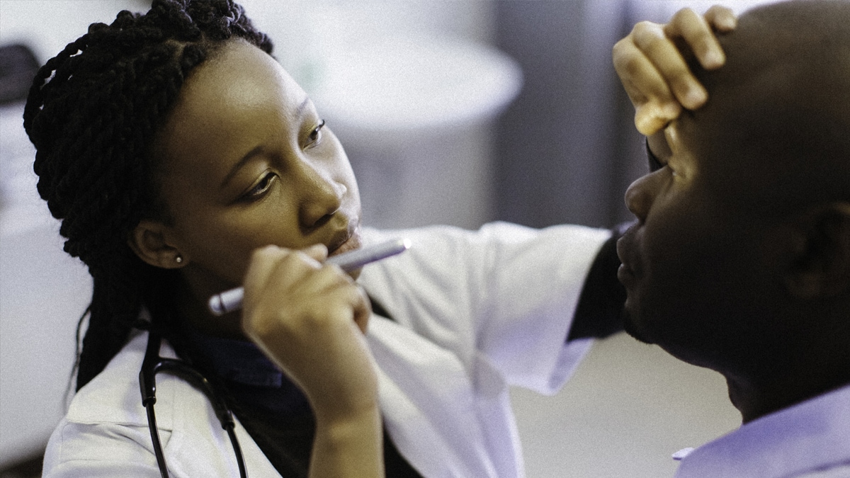 A doctor performing an eye examination