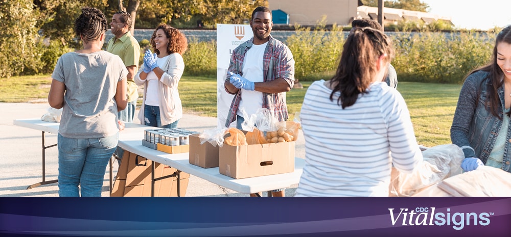 Volunteers preparing and distributing food.