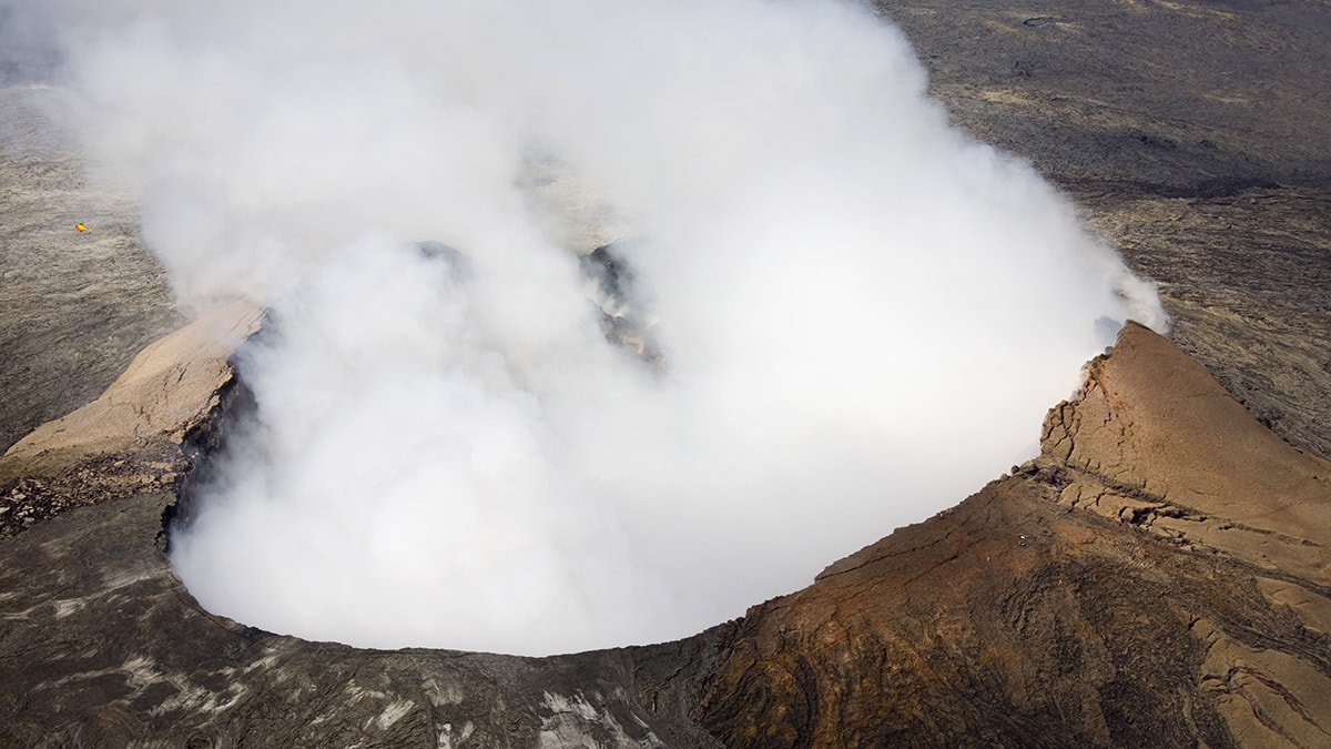 Cloud of ash rising from an active volcano.