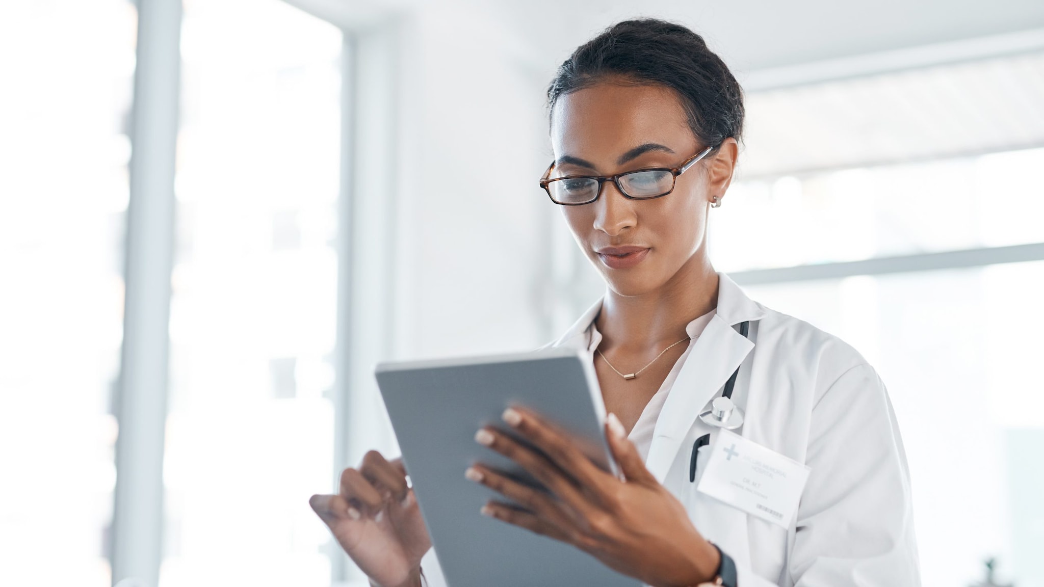 Doctor looking at a tablet