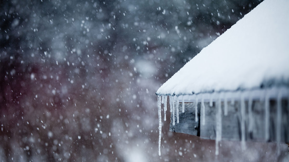 Icicles on a snowy roof