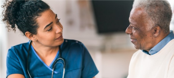 A doctor speaking with a patient.