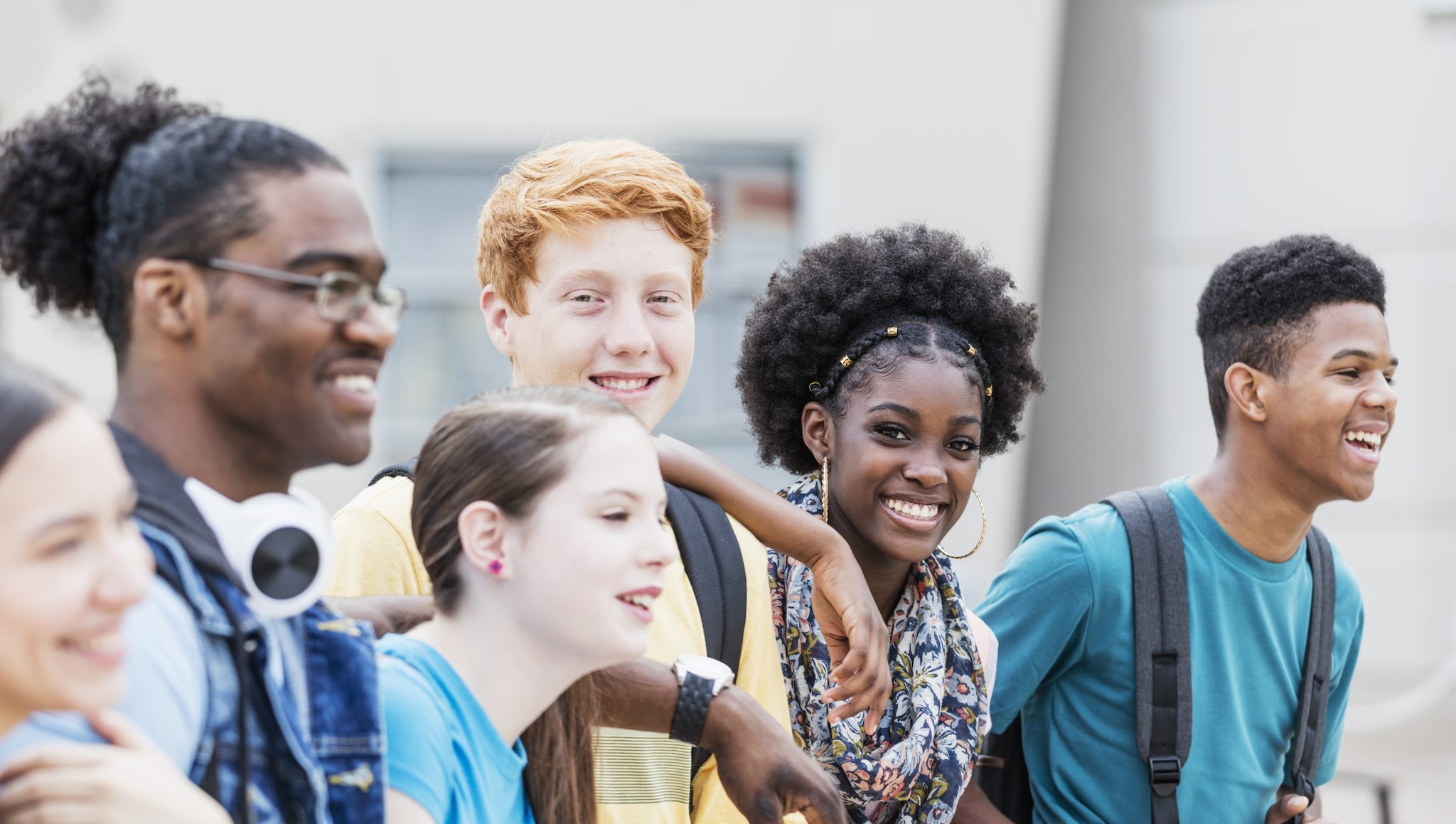 Diverse high schools group smiling.