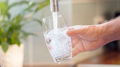 Person getting a glass of water.